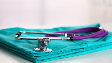 Stethoscope on a background of medical coat.の写真素材