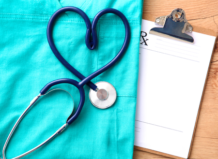 Stethoscope on a background of medical coat.の写真素材