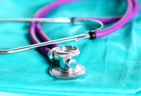 Stethoscope on a background of medical coat.の写真素材
