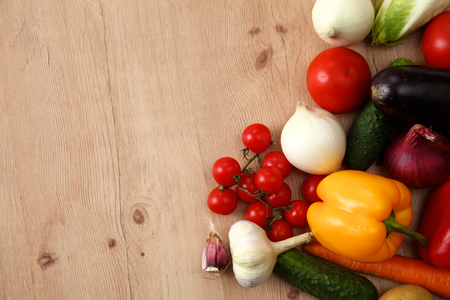 Composition with assorted raw organic vegetables wooden table.の写真素材