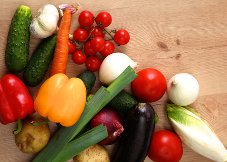 Composition with assorted raw organic vegetables wooden table.の写真素材