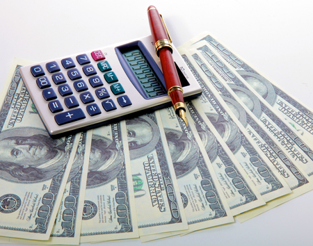 Image the money with calculator and financial tables with numbers.の写真素材