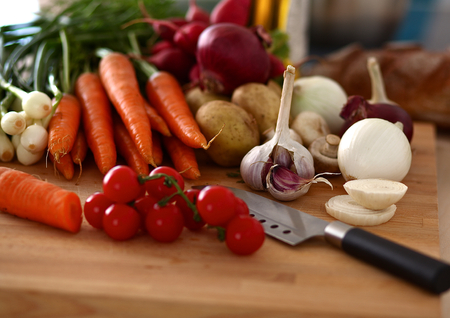 Composition with assorted raw organic vegetables wooden table.の写真素材