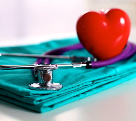 Medical stethoscope rests on a uniform close-up.の写真素材