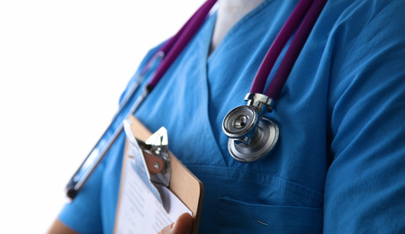 Close-up of unknown female doctor with stethoscope isolated.の写真素材