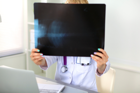 Portrait of happy medical doctor woman in office.の写真素材