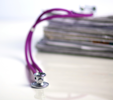 books folder file and stethoscope isolated on white background.の写真素材