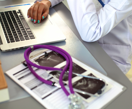 Portrait of happy medical doctor woman in office.の写真素材