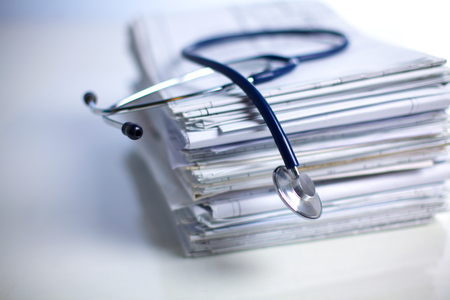 books folder file and stethoscope isolated on white background.の写真素材