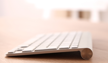 Aluminum computer keyboard on table.の写真素材