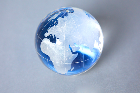 Cristal globe of the Earth on a Computer.の写真素材