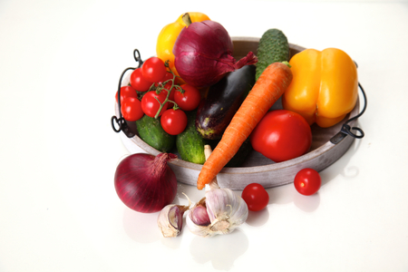 Composition with assorted raw organic vegetables on table.の写真素材