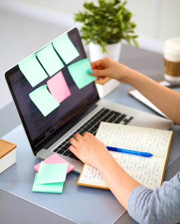 A young businesswoman working on a laptop .の写真素材