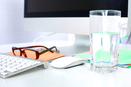 Office workplace with laptop and smart phone on wood table.の写真素材