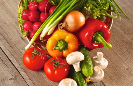 Composition with assorted raw organic vegetables wooden table.の写真素材