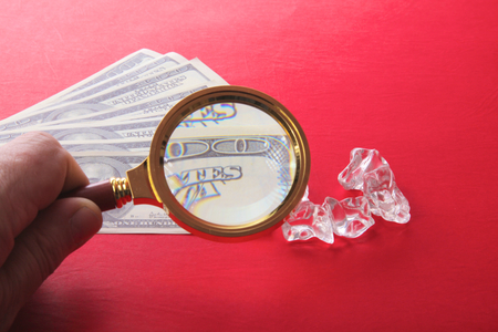 diamonds and money are on the tableの写真素材