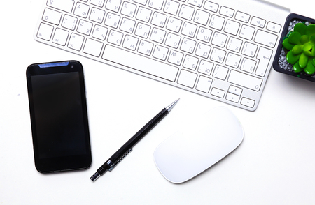 open daily, a computer and a smartphone on the desktop in the ofの写真素材