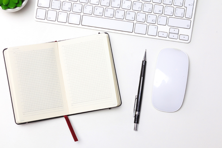 open daily, a computer and a smartphone on the desktop in the officeの写真素材