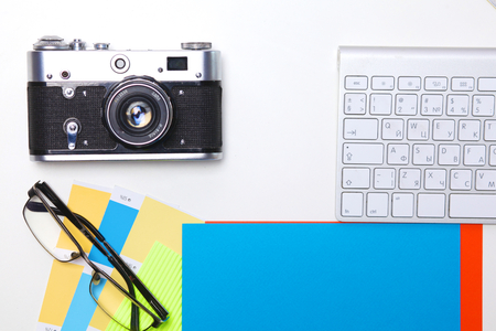 Top view of office graphic design pen mouse with laptop wireless mouse and vintage old camera on white table. Concept graphic design workplaceの写真素材