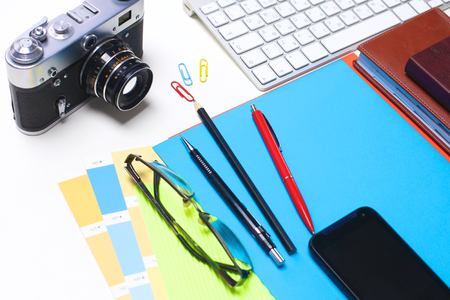 Top view of office graphic design pen mouse with laptop wireless mouse and vintage old camera on white table. Concept graphic design workplaceの写真素材