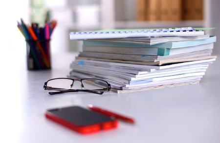 close up of stack of papers on white backgroundの写真素材