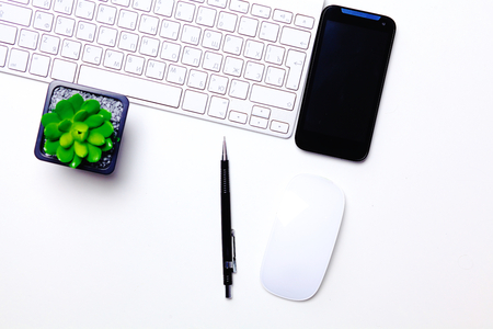 open daily, a computer and a smartphone on the desktop in the officeの写真素材