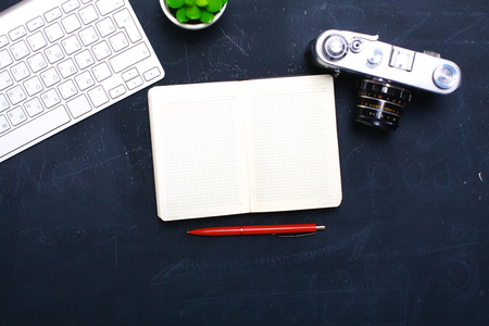 Top view of office graphic design pen mouse with laptop wireless mouse and vintage old camera on tableの写真素材