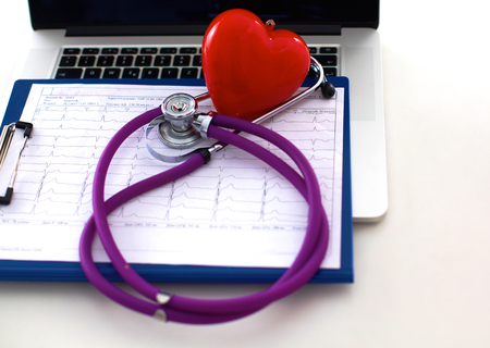 Medical stethoscope lies on the patients medical history. Medical help or insurance conceptの写真素材