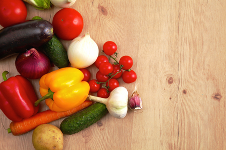 Composition with assorted raw organic vegetables wooden tableの写真素材