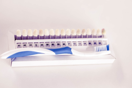 dental care toothbrush with dentist tools on white backgroundの写真素材