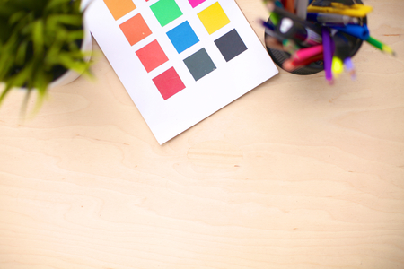 Office table with blank notepad and laptopの写真素材