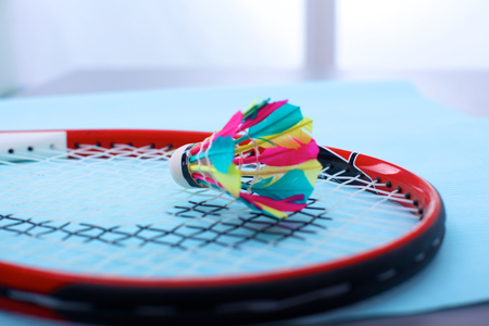 Close-up of badmington rackets with balls on a blue backgroundの写真素材
