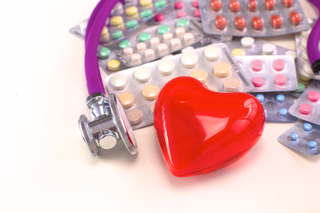 Stethoscope and some pills - isolated on a white backgroundの写真素材