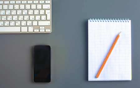 office desk with laptop, pen, and notebook. Top viewの写真素材