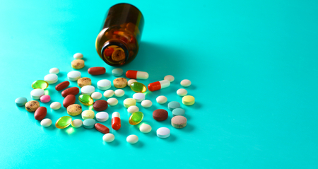 Medical pills and a bottle lie on the table. Medical conceptの写真素材