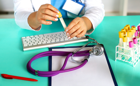 the wife of the doctor at the desk in the officeの写真素材