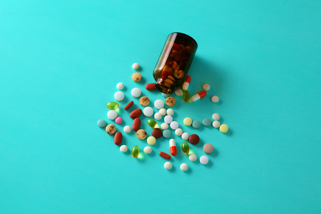 Medical pills and a bottle lie on the table. Medical conceptの写真素材