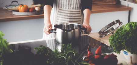 Young Woman Cooking in the kitchen. Healthy Foodの写真素材