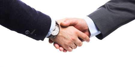 Business people handshake, sitting at the table