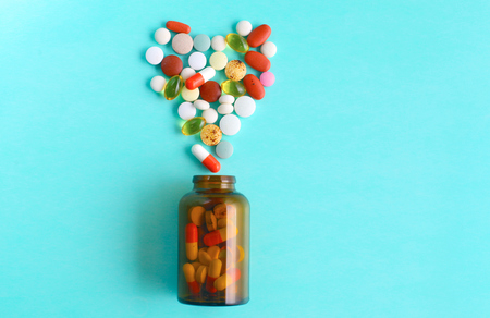 Medical pills and a bottle lie on the table. Medical conceptの写真素材