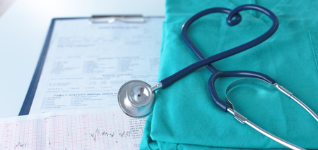 A stethoscope shaping a heart on a medical uniform, closeupの写真素材