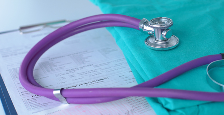 A stethoscope shaping a heart on a medical uniform, closeupの写真素材