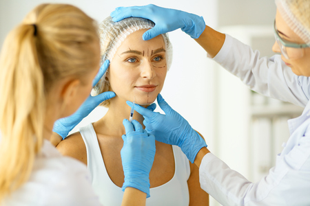 woman getting injection. beauty injections and cosmetologyの写真素材