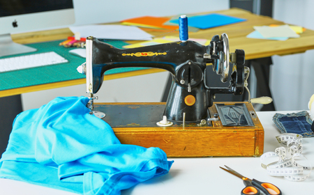 Empty workroom and workplace of tailor or vendor of clothes in small boutiqueの写真素材