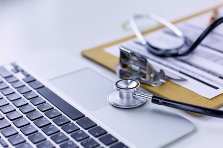 Doctors workspace working table with patients discharge blankの写真素材