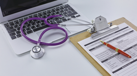 Doctors workspace working table with patients discharge blankの写真素材