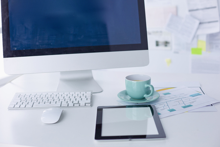 A cup of coffee on the office tableの写真素材