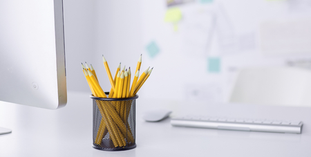 Graphite pencils in a metal grid-container. Conceptの写真素材