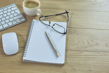 A cup of coffee on the office tableの写真素材