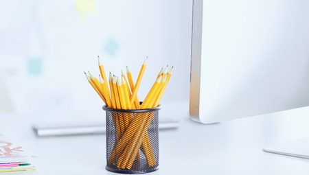 Graphite pencils in a metal grid-container. Conceptの写真素材